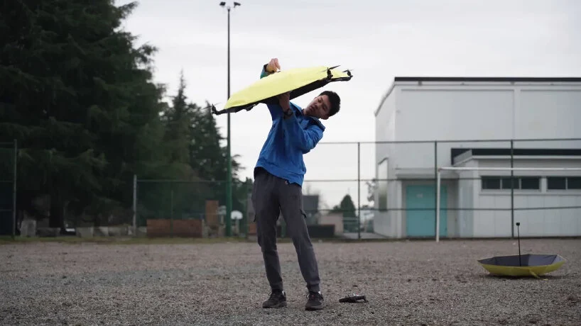 The flying umbrella with a drone has propellers that make it go up in the air.