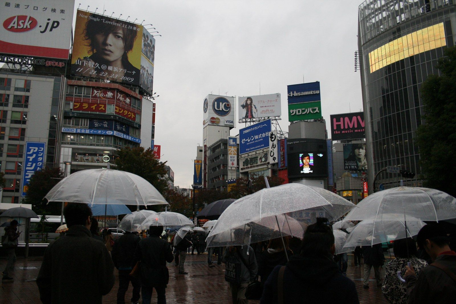 Commuters with umbrellas crossing Shibuya in Tokyo during the Tokyo rainfall record rain