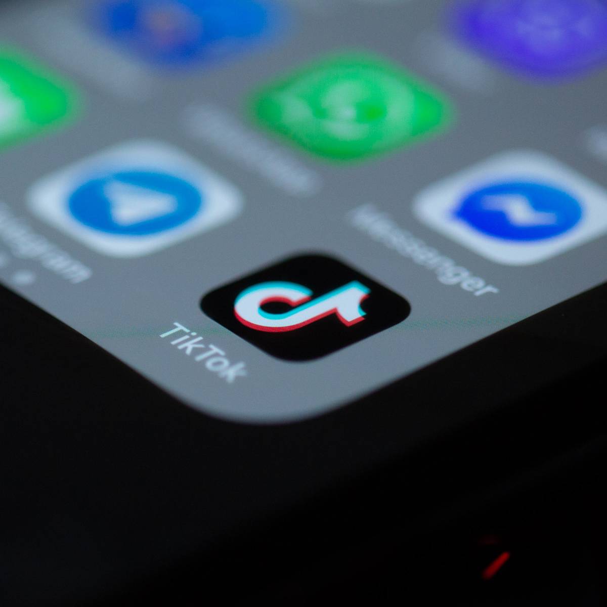 The TikTok app icon on a smartphone screen
